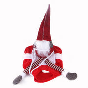 Red and white gnome figurine with a long beard on a white background