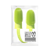 Two green silicone toothbrushes in a clear packaging on a white background