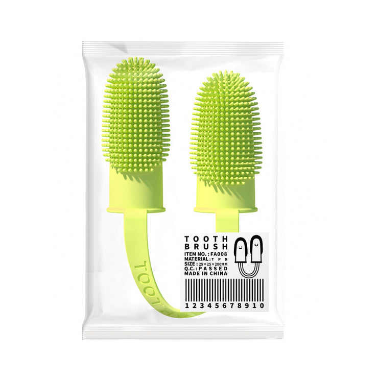 Two green silicone toothbrushes in a clear packaging on a white background