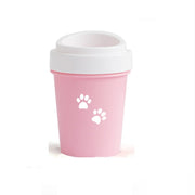 Pink reusable cup with white paw prints on a white background