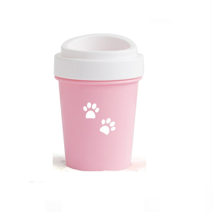 Pink reusable cup with white paw prints on a white background