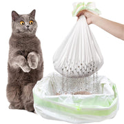 Cat reaching for a plastic bag filled with cat litter, with a hand holding the bag.