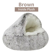 Gray plush pet bed with white interior on a white background