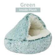Plush green pet bed with white interior on a white background