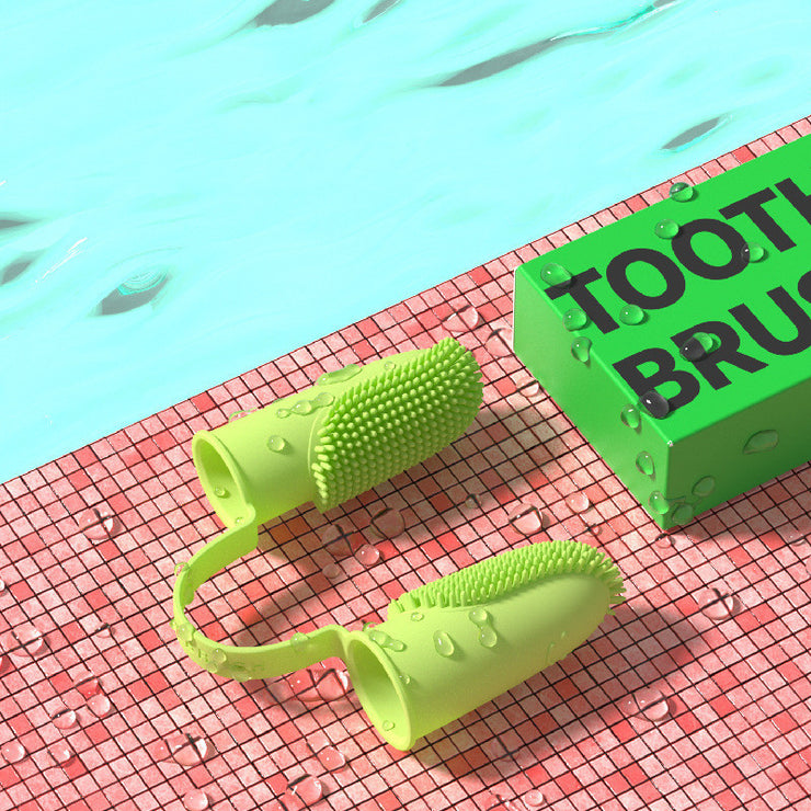 Green dog toothbrush with bristles on a red and green checkered surface.