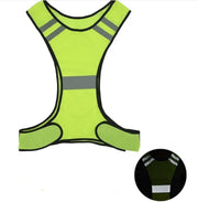 Green reflective safety vest with gray stripes on a white background
