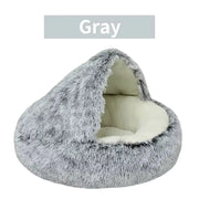 Gray pet bed with a white interior on a white background