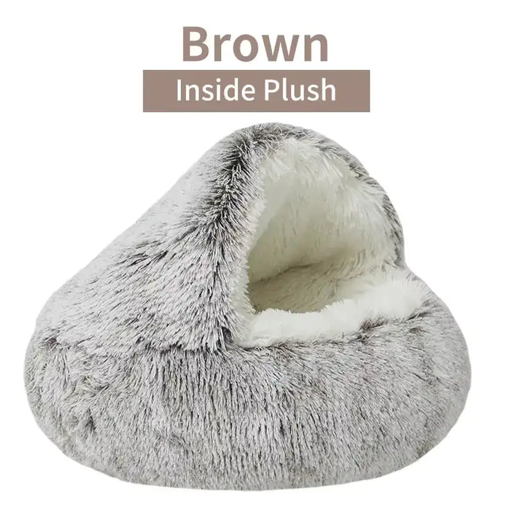 Gray plush pet bed with white interior on a white background