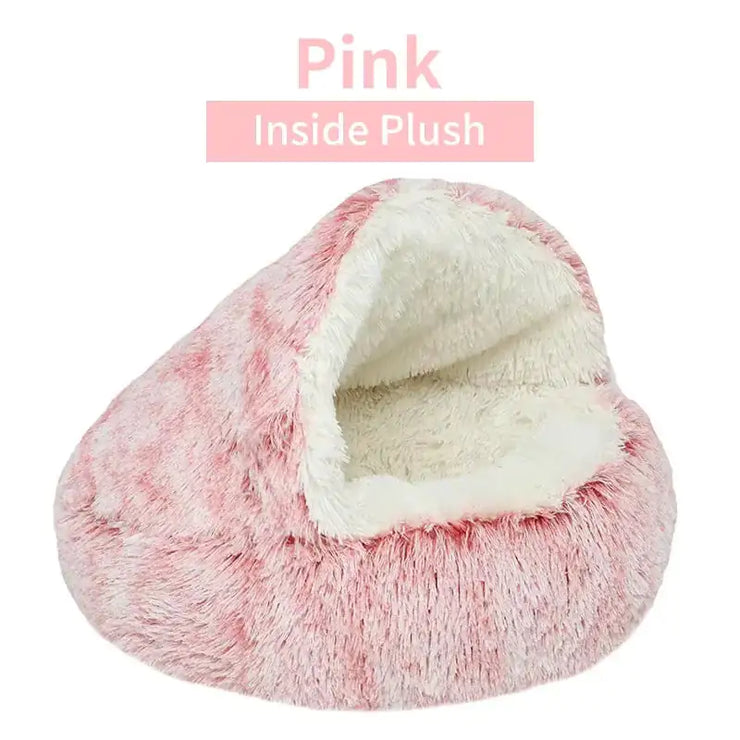 Pink plush pet bed with white interior on a white background