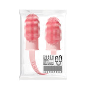Pink silicone toothbrushes in packaging on a white background