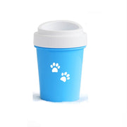 Blue cup with white paw prints on a white background