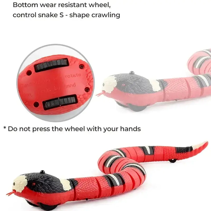 Red and black snake-shaped toy with a control wheel on a white background